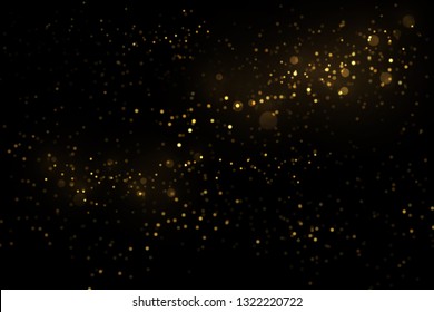 Golden particles explosion on black background