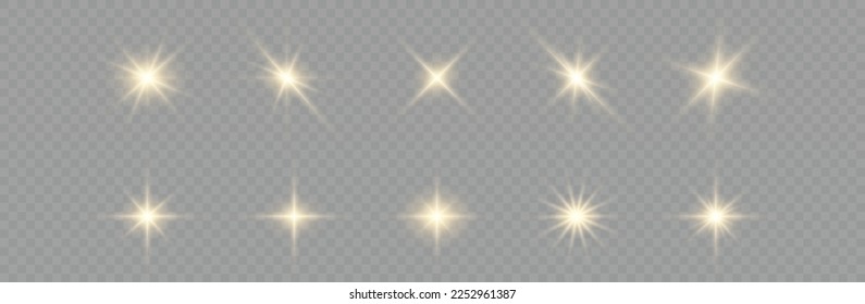 Golden particles of light. Golden light. Light flare.Stars isolated on transparent background.
