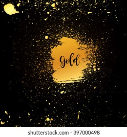 Golden particles of the precious metal on a dark background