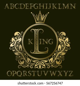 Golden patterned letters and initial monogram in coat of arms form with crown. Royal font and elements kit for logo design.