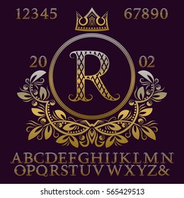Golden patterned letters and numbers with initial monogram in coat of arms form. Elegant font and elements kit for logo design.