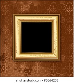 Golden picture frame on the grunge wall