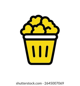 Golden popcorn overflows container at snack isolated closeup