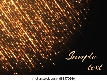 The golden rays of light shine against a dark background. Festive decoration for the new year and Christmas.