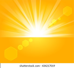 Golden Rays rising from horizon in light background