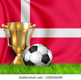 Golden realistic winner trophy cup and soccer ball isolated on national DENMARK flag. National team is the winner of the football. First place trophy. Sport design background. Template poster winner.