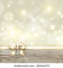 Golden ribbon bow with bokeh Christmas decoration