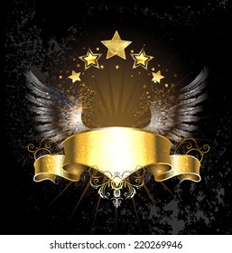 Golden ribbon decoration angel wings and gold stars on black background.