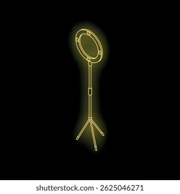 Golden ring light emitting bright light in dark studio, perfect for photography or videography