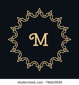 Golden round ornament with letter M, frame, border, line art icon. Floral linear motif. Isolated design element for brochure, invitation card, logo, monogram, emblem. Gold and black background