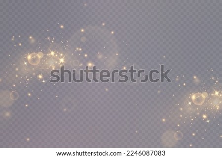 Golden sequins glow with many lights. Glittering dust. Luxurious background of golden particles.