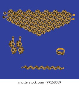 golden set from necklace ring earrings and bracelet with black stone on dark blue background