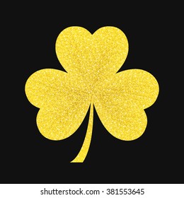 Golden Shamrock is a symbol of St. Patrick's day. The feast of Saint Patrick is celebrated on March 17. Gold Shamrock on a black background