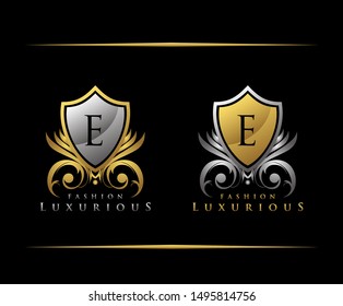 Golden Shield E Letter Logo. Gold Vintage Shield With E Letter prefect for boutique, hotel, restaurant, wedding and other elegant business. 