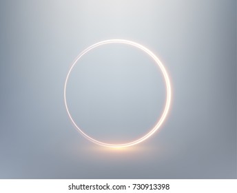 Golden shiny ring shape on gray background.