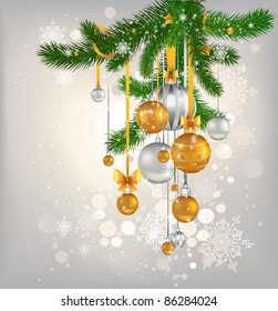 golden and silver balls hanging on the tree