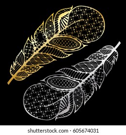 Golden and silver feathers in zen art style. Set of two hand drawn ornate feathers for your design