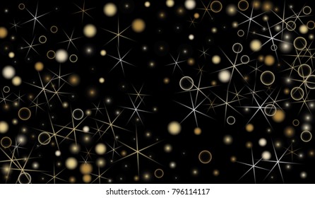 Golden Snowflakes. Christmas Confetti. Festive Background with Yellow and Orange Bokeh and Stars. New Year Background with Gold Glitter made of Snowflakes and Stars. Confetti on Black Backdrop