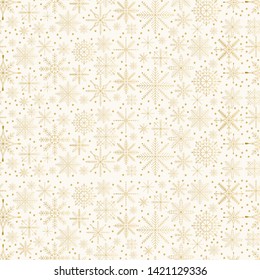 Golden snowflakes pattern. Christmas glitter background.