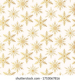 Golden snowflakes seamless pattern.  Magic holiday texture for Merry Christmas. Vector isolated winter gold festive background for wrapping paper.