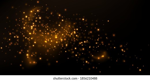 Golden sparkles and particles on dark. Abstract background with magical glowing lights. 