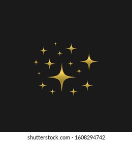 Golden sparkles. Golden stars over black background, glittering effect