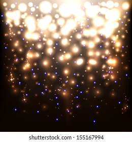 Golden sparkling background with intense glowing sparkles and glitter