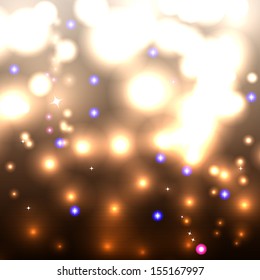 Golden sparkling background with intense glowing sparkles and glitter