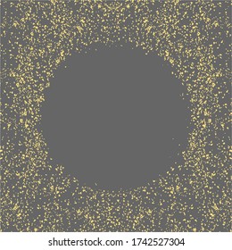 Golden splash or glittering spangles round frame with empty center for text. Gold glittering circle made of tiny dots on grey background