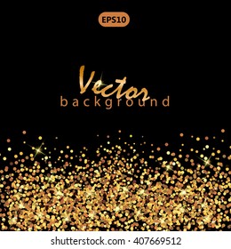Golden splashes on black background. Gold glitter background. Gold sparkles.