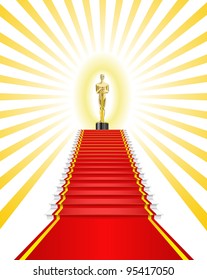 Golden statuette a man on the red carpet is shown in the picture.