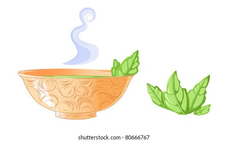 Golden tea cup with mint leaf