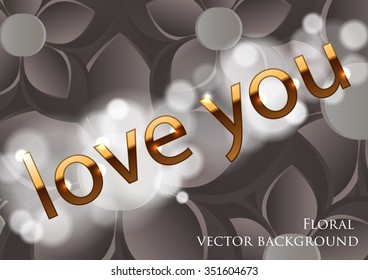 golden text on a gray background with floral ornament and bokeh effect