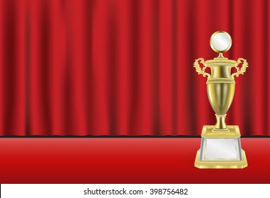 golden trophy with red curtain background