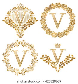 Golden V letter vintage monograms set. Heraldic coats of arms and round frames.