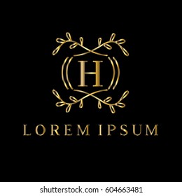 Golden vector monogram. Letter H logo design template