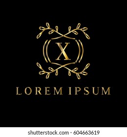 Golden vector monogram. Letter X logo design template