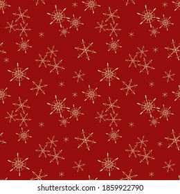 Golden vector snowflakes seamless pattern. Elegant red Christmas and New Year background texture with gold snow, small snowflakes, sparkles. Winter holidays theme. Luxury repeat design for decoration