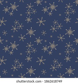 Golden vector snowflakes seamless pattern. Elegant Christmas and New Year background texture with gold snow, snowflakes, sparkles on blue. Winter holidays theme. Luxury repeat design for decor, print