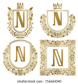 Golden vintage monograms set. Heraldic logos with letter N.