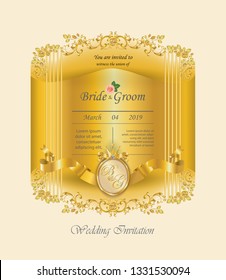 Golden wedding invitation card decorated with baroque metal elements and gold ribbon 