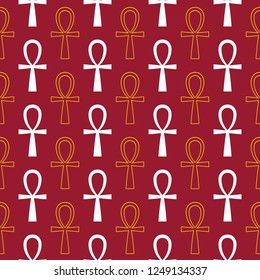 Golden and white ancient egyptian ankh signs, symbols on red seamless pattern background.