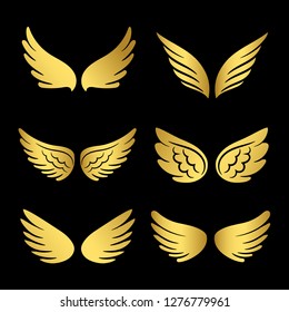 Golden wings vector collection. Angels wings isolated on black background. Illustration of golden angel wing set