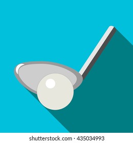 Golf club and ball with long shadow