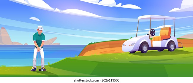 Golf course on lake shore with man and cart