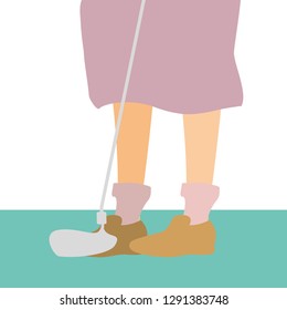 golf player feet with stick