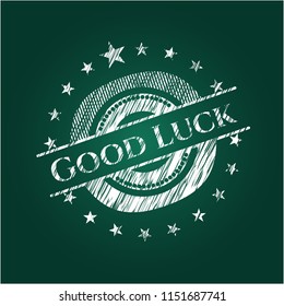 Good Luck chalkboard emblem written on a blackboard