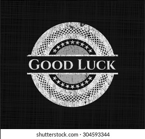Good Luck chalkboard emblem written on a blackboard