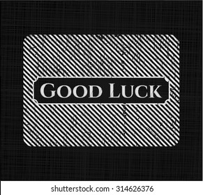 Good Luck chalkboard emblem written on a blackboard