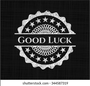 Good Luck chalkboard emblem written on a blackboard